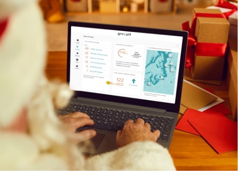 Santa looking at Groopit on laptop